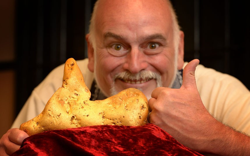 Gold dealer Cordell Kent poses at the Mining Exchange Gold Shop with a 5.5kg gold nugget which was found by a prospector in Australian bush land
