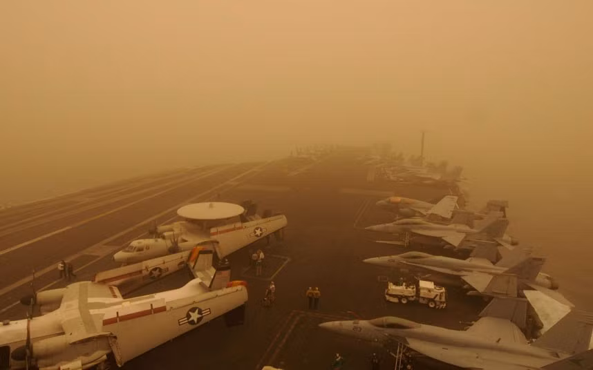 The USS Carl Vinson is caught up in the middle of a huge sandstorm as it travels through the Persian Gulf