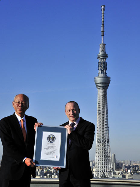 Tokyo Sky Tree company president Michiaki Suzuki receives a certificate from Alistair Richards of the Guinness World Records. The 634-metre-tall Tokyo Sky Tree tower was recognised as the world’s tallest self-supporting tower. It is set to be completed today, after a two-month delay due to last year’s quake and tsunami.