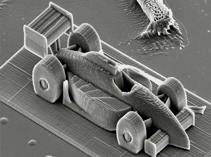 Những hình ảnh ấn tượng trong tuần ảnh 2 This racing car is the size of a grain of sand. Researchers at the Vienna University of Technology used a 3D printer with nano precision to break the world record for fastest two-photon lithography. The technique sees liquid resin hardened by a laser beam. The focal point of the laser beam is guided through the resin by movable mirrors, and leaves behind a line of solid polymer, just a few hundred nanometres wide. This high resolution enables the creation of intricately structured sculptures as tiny as a grain of sand.