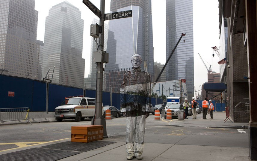 ...Liu Bolin has unveiled his new Ground Zero and Tiles for America art, standing in front of the new Freedom Tower, which replaced the Twin Towers in New York. Liu Bolin has received international acclaim for his technique of cleverly painting himself to blend in with the background.