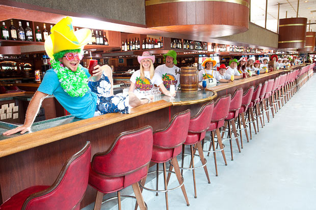 Beer Barrel Saloon - Longest Bar The world’s longest permanent continuous bar is the counter in the Beer Barrel Saloon which is 123.7 m 405 ft 10 in long and opened at Put-in-Bay, South Bass Island, Ohio, USA, in 1989. The bar is fitted with 56 beer taps and surrounded by 160 bar stools. Longer temporary bars have been erected, notably for beer festivals