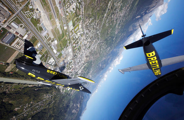 L-39C Albatros aircraft from the Breitling Jet Team perform over the Rhone Valley during a media presentation flight ahead of the Sion Air Show. The air show will take place in Sion from September 16 to 18.