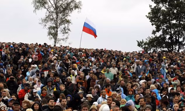 Captive audience: Spectators gather to watch the reenactment marking the 200th anniversary of the Battle of Borodino Read more: http://www.dailymail.co.uk/news/article-2197748/President-Putin-watches-recreation-200-year-old-battle-glorified-Tolstoy-led-fall-Napoleon-troops-retreated-Moscow.html#ixzz25UGJdmgZ