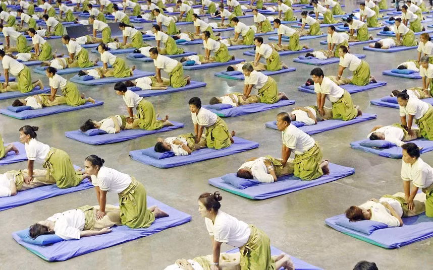 Some 641 Thai masseurs and masseuses establish a new Guinness World Record at an indoor sport arena on the outskirts of Bangkok 