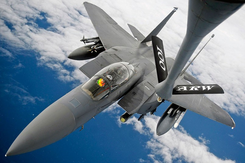 A US Air Force F-15E Strike Eagle receives fuel from a 100th Air Refuelling Wing KC-135 Stratotanker during an aerial mission over the Atlantic Ocean