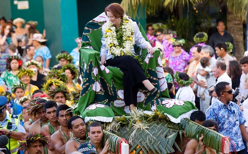 Australian Prime Minister Julia Gillard is carried in a pa