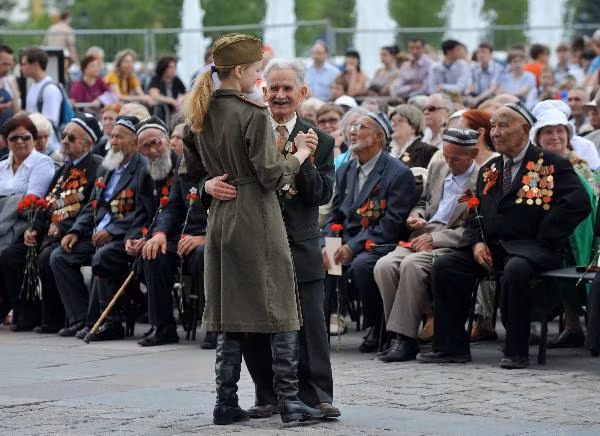 People visit a World War II memorial in the former village of Khatyn, some 60 km (37 miles) northeast of Minsk, May 8, 2010
