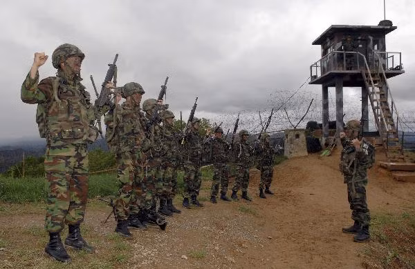 South Korean soldiers chant slogans before they conduct a search operation near the demilitarized zone 