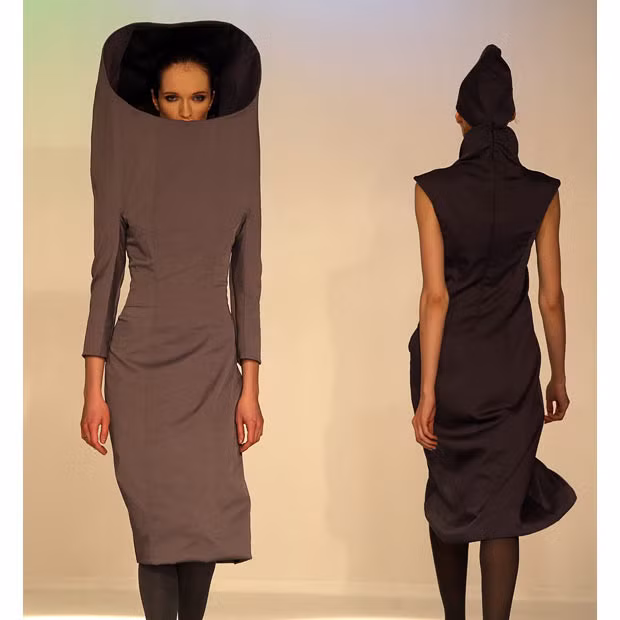 Models display creations by fashion designer Maria Tsuman during a fashion show in Moscow
