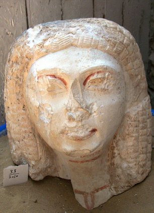 Hieroglyphs carved into the rock reveal the name and position of Ptahmes (left), the mayor of the ancient Egyptian capital Memphis. Right: The head of a female statue found within the tomb Read more: http://www.dailymail.co.uk/sciencetech/article-1282628/Ancient-Egyptian-mayors-tomb-century-lost.html#ixzz0pSgLJ9n4