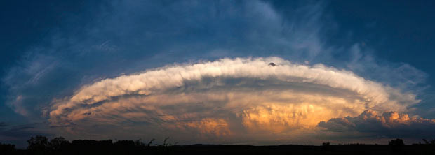 Following a torrential shower and hail that swept across western Hungary, clouds form into a vast ring over the region of Gyoer, west of Budapest, Hungary