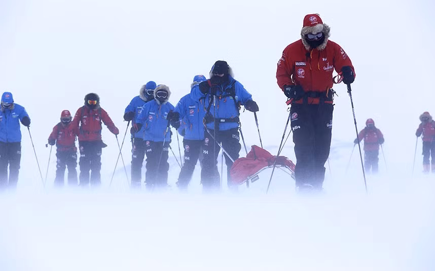Prince Harry, (R) patron of Team UK in the Virgin Money South Pole Allied Challenge 2013 expedition, pulling the pulk which is guiding US team member Ivan Castro, who is blind, as he takes part in ski training near Novo, Antarctica.