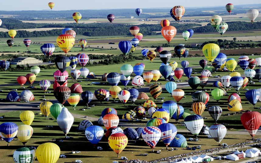 Hot air-balloons take off from Chambley-Bussieres, eastern France, to try to set up a new world record with 408 balloons in the sky, as part of the yearly event 