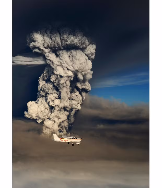 A small plane flies past the ash and smoke plume from the eruption of the Grimsvotn volcano, under the Vatnajokull glacier in southeast Iceland. Airlines began cancelling flights to Britain because of the ash cloud reaching its airspace, although experts expected no repeat of the travel chaos from an eruption a year ago. 
