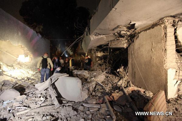 Con trai và 3 người cháu ông Gaddafi thiệt mạng sau đợt không kích của NATO ảnh 1 This photo taken on May 1, 2011 shows the damage of the house of the Libyan leader Muammar Gaddafi