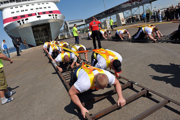 Twenty men yoked to the 20,000-ton Tallink cruise ship, Baltic Queen, manage to set a new record for ship-pulling in Tallinn harbour, Estonia