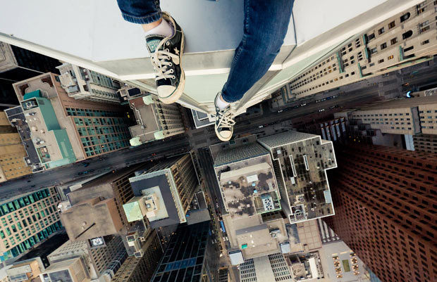 Photographer Tom Ryaboi, from Toronto in Canada, dangles from the edge of skyscrapers to capture aerial shots that require a head for heights. Describing his passion for the style of photography called Rooftopping, Tom says: 