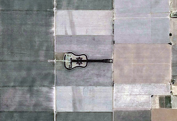 An aerial photo shows trees forming a guitar shape at a farm in La Pampa Province, Argentina. Farmer Pedro Martin Ureta planted roughly 7,000 cypress and eucalyptus trees in the shape of a guitar in memory of his late wife.
