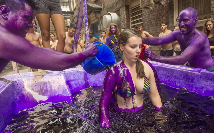Students at Toronto University dye a freshman as per tradition in Ontario, Canada. First-year student engineers traditionally are dyed purple at most Canadian universities by the more senior class. The dye wears off after about a week.