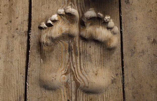 Footprints carved in wood, which locals believe were made by a worshipper who prayed at the same spot for decades, are seen at a monastery near Tongren, Qinghai province, China