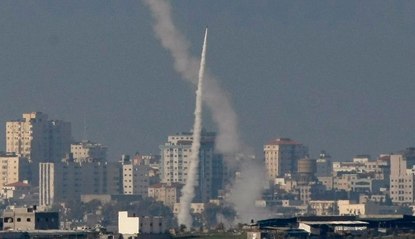 A rocket fired by Palestinian militants from the northern Gaza Strip flies towards an Israeli target Friday, Jan. 2, 2009. (AP Photo/Bernat Armangue)