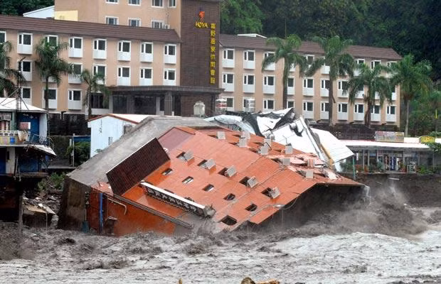 The Hotel Chin shuai lies collapsed in floodwater during typhoon Morakot in Chihpen, in southeastern Taiwan’s Taitung county on August 9, 2009