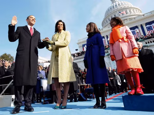 Barack H. Obama is sworn in as the 44th president of the United States as his wife Michelle Obama holds the Bible and their daughters Malia Obama and Sasha Obama look on, on the West Front of the Capitol January 20, 2009 in Washington, DC. (Chuck Kennedy-Pool/Getty Images)