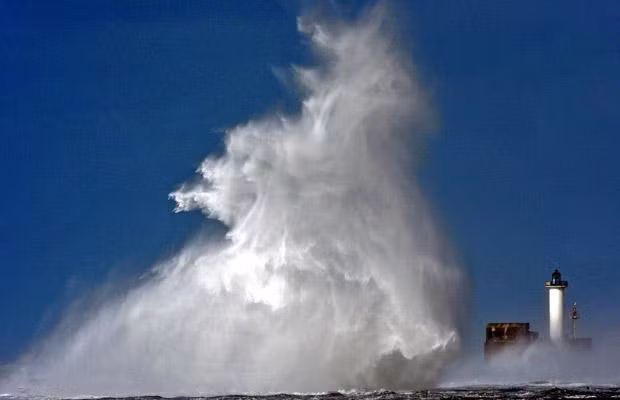 A huge wave hits the entrance of the port of Boulogne-sur-Mer on March 12, 2008