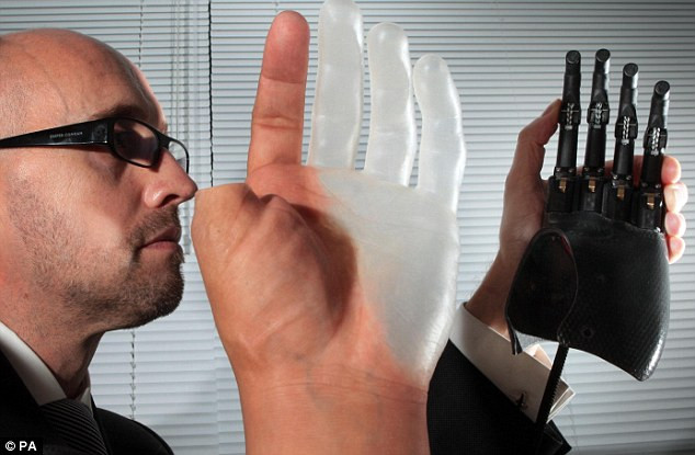 Phil Newman, marketing director of Touch Bionics, demonstrates the world’s first bionic fingers