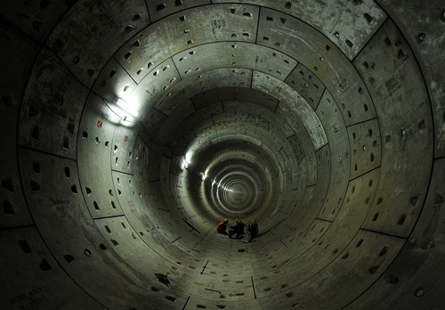 Delhi Metro Rail Corporation (DMRC) employees work on the last-pre cast segments (rings) of the Phase-II underground tunneling project between neighborhoods Jangpura and Lajpat Nagar in New Delhi on October 12, 2009, part of a larger project to have metro lines to cover the entire National Capital Region for the 2010 Commonwealth Games (MANAN VATSYAYANA/AFP/Getty Images)