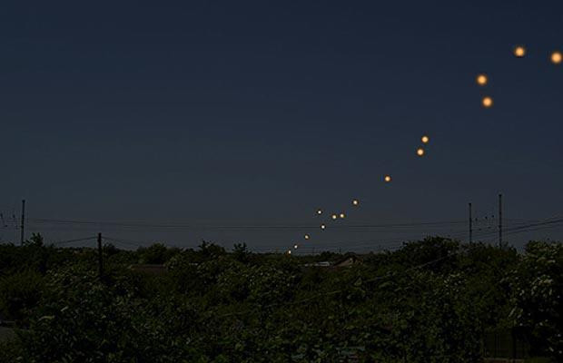A number of people claimed to have seen UFOs in Cambridgeshire after dazzling orange lights flashed across the night sky