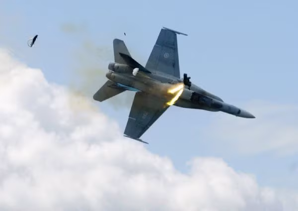 Pilot Capt. Brian Bews ejects as his CF-18 fighter jet plummets to the ground during a practice flight at the Lethbridge County Airport on Friday,