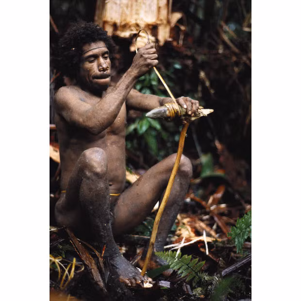 Almost 3,000 members of the nomadic clan, whose people wear only banana leaves, were recorded for the first time in the country’s census this year. A stone axe gets re-wrapped in rattan. The Koroway say they don’t know where the axe stones come from, but ethnologists assume they were quarried in the highlands and then traded down through generations of exchange relationships 