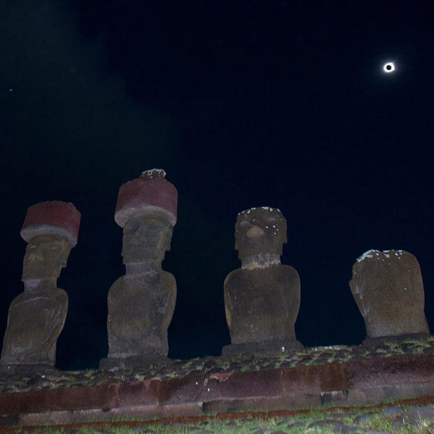 A row of Moai - 3,000-year-old large stone statues - are seen during a total solar eclipse on Easter Island