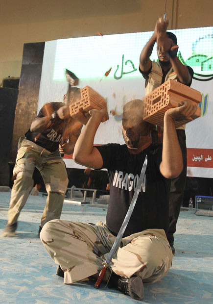 Martial arts performers of the Dragon show team break bricks during a public performance in Riyadh, Saudi Arabia... 