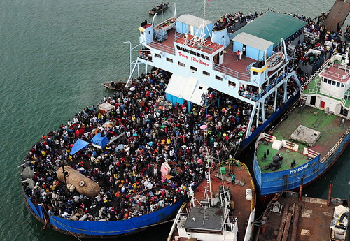Haitian citizens crowd a ship in Port-au-Prince, Haiti, on Saturday