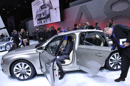Audi A8 Visitors are attracted by an Audi A8 sedan during the media preview of the 2010 North American International Auto Show (NAIAS) at Cobo center in Detroit, Michigan, the United States, Jan. 11, 2010.