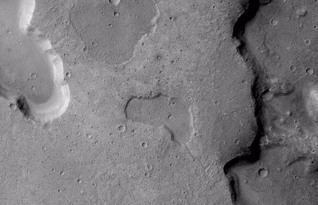 A NASA image of depressions on Mars interpreted as ancient lake basins. Note channel connecting depressions in bottom right providing clear evidence of liquid exchange between depressions. Depression in centre is 3 km wide