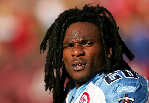 Gold-toothed football player Chris Johnson of the Tennessee Titans sits on the bench during their game against the San Francisco 49ers at Candlestick Park on November 8, 2009 in San Francisco, California