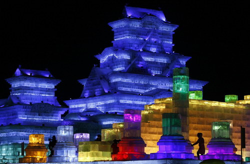 Ice sculptures stand illuminated from within at the annual Ice and Snow festival in Harbin, northeast China’s Heilongjiang province on January 5, 2010. Fairy tale palaces, towering pagodas, and even an Egyptian Sphinx - all carved from ice - are among the sights at this year’s festival