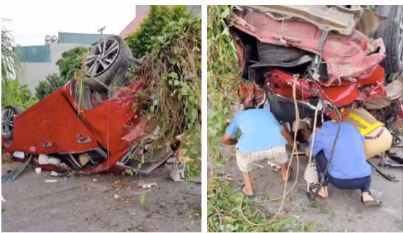 Lực lượng chức năng và người dân phối hợp đưa nạn nhân bị mắc kẹt trong xe ô tô ra ngoài.