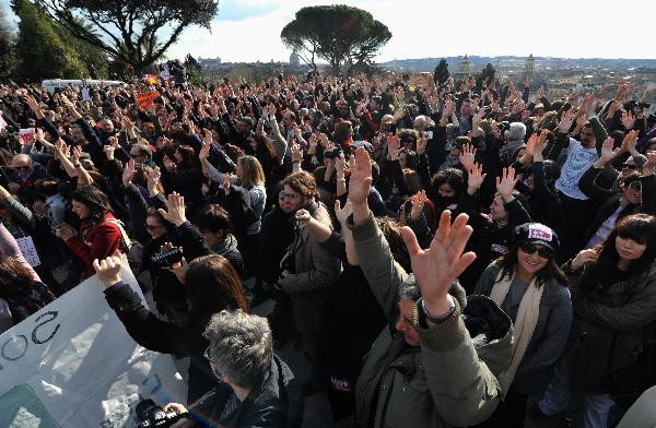 Crowds gather at the People’s Plaza during a mass protest against Italian Prime Minister Silvio Berlusconi’s sex scandals in Rome, Italy, Feb. 13, 2011. 