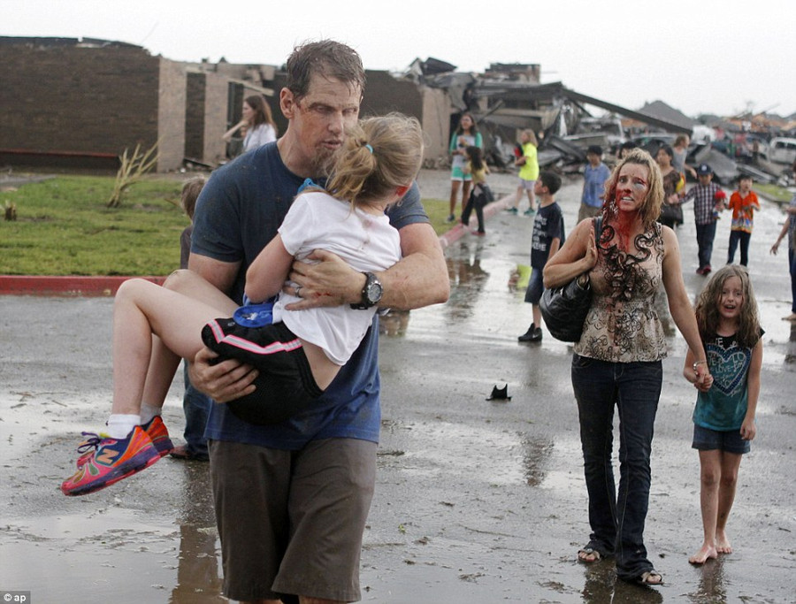 Horror: Teachers carry children away from Briarwood Elementary school after a tornado destroyed the school in south Oklahoma City Read more: http://www.dailymail.co.uk/news/article-2328000/US-tornadoes-Yet-heartbreak-Oklahoma-massive-tornado-touches-highly-populated-suburb.html#ixzz2TtMnodlk Follow us: @MailOnline on Twitter | DailyMail on Facebook