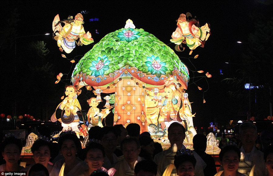 Legend: A float depicts the tree under which Buddha was believed to have been born around 25 centuries ago Read more: http://www.dailymail.co.uk/news/article-2323047/South-Korea-lit-sea-lanterns-Seoul-prepares-mark-Buddha-s-birthday.html#ixzz2T5V2g19H Follow us: @MailOnline on Twitter | DailyMail on Facebook