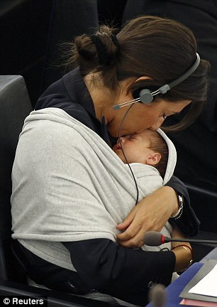 Mrs Ronzulli continued with business as normal, only pausing to plant a tender kiss on her child’s head Read more: http://www.dailymail.co.uk/news/article-1314283/Licia-Ronzulli-brings-baby-EU-Parliament.html#ixzz10L2HNxkd