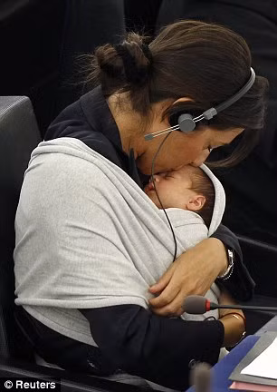Mrs Ronzulli continued with business as normal, only pausing to plant a tender kiss on her child’s head Read more: http://www.dailymail.co.uk/news/article-1314283/Licia-Ronzulli-brings-baby-EU-Parliament.html#ixzz10L2HNxkd