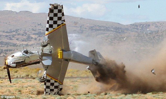 Debris can be seen flying from the plane as it spins out of control Read more: http://www.dailymail.co.uk/news/article-1313738/Caught-camera-The-spine-chilling-moment-pilot-crashed-plane-ground--climbed-unscathed.html#ixzz0zwz1Y61H