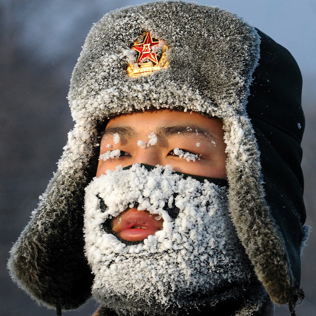 A soldier looks frozen during training, as newly recruited soldiers of the People’s Liberation Army take part in a training session in Yichun, Heilongjiang Province, China...