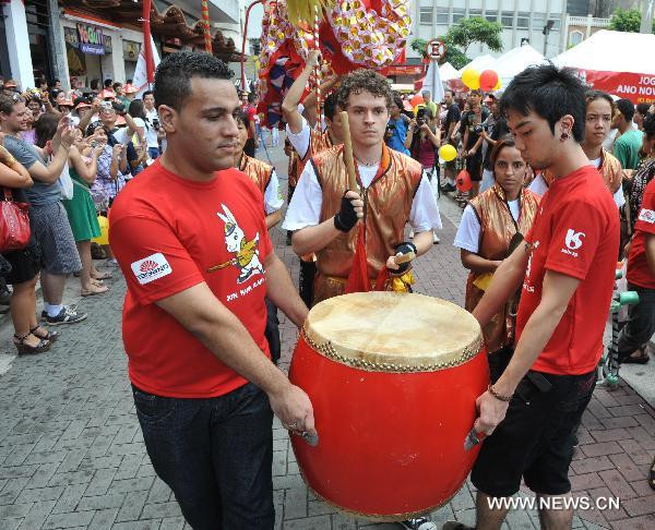 People perform the traditional Chinese drum in the plaza of Liberty in Sao Paulo, Brazil, Jan. 29, 2011